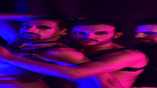 Vertical video of group of gay men in an intimate setting in a loving attitude towards each other.