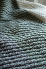 Green and gray crocheted blanket
