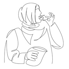 Muslim woman eating croissant