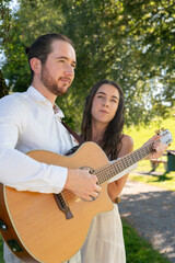 guitarrist player and singer gigging outdoors