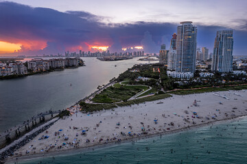 Aerial view of Miami Beach sunset with stormy clouds over downtown Miami
