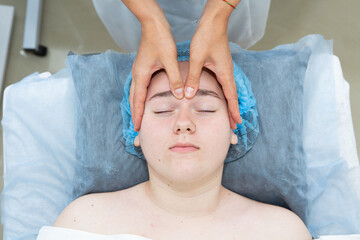 The girl is given a facial massage. Rest and relaxation, SPA care for body and face