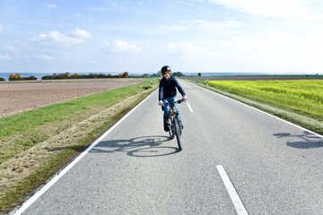 young boy with mountain bike on tour