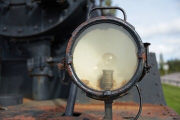 Closeup detail of old steam locomotive headlight.