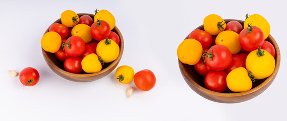 red and yellow tomatoes in a round bowl on a light background