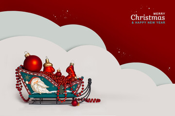 New Year's Christmas decor sleigh with red Christmas tree toys on the snow. Greeting card. Postcard for congratulations on the New Year and Christmas holiday.