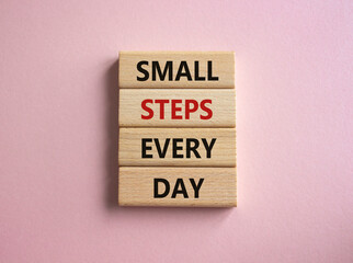 Small Steps Every Day symbol. Wooden blocks with words Small Steps Every Day. Beautiful pink background. Business and Small Steps Every Day concept. Copy space.
