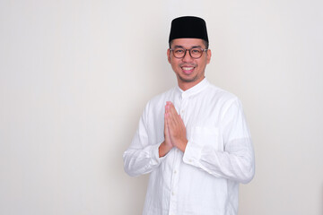 Moslem Asian man do friendly greeting with hand praying pose