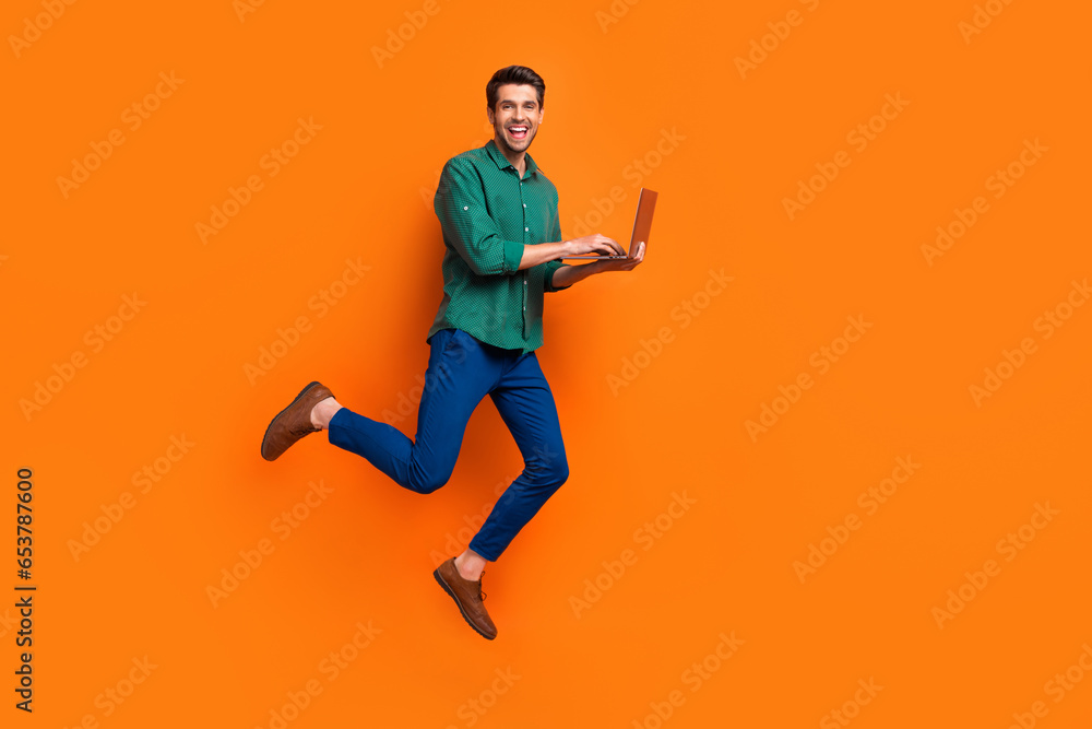 Poster Full length body photo of jumping professional it specialist browsing netbook project manager employer isolated on orange color background