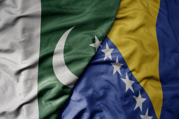 big waving realistic national colorful flag of pakistan and national flag of bosnia and herzegovina...
