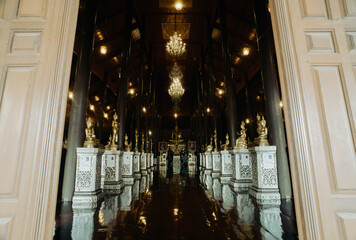 Museam of Wat Krathum Suea Pla(temple) ,Bangkok, Thailand. the principal body of a Buddha statue 80. And surrounded by 80 smaller Lord Buddha in various postures.