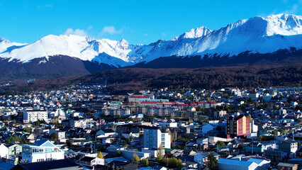 Downtown Ushuaia Argentina at Tierra del Fuego. Natural landscape of scenic town between mountains. Ushuaia Argentina. Patagonia Argentina at Ushuaia Tierra del Fuego Argentina. Downtown city. - obrazy, fototapety, plakaty