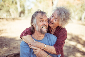 Happy elderly couple hug in the Northern Territory