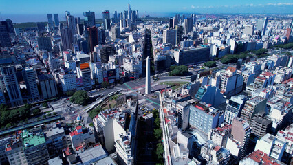 Fototapeta premium Obelisk Square Cityscape of Buenos Aires Argentina. Panorama landscape of touristic landmark downtown capital Argentina. Touristic landmark. Outdoor downtown city. Urban scenery of Buenos Aires city.