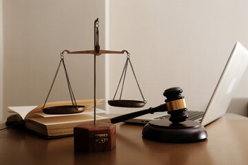 Business and lawyers discussing contract papers with brass scale on desk in office. Law, legal...