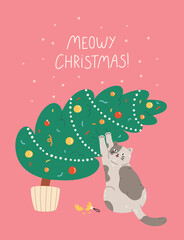 Christmas and New Year greeting card with cute cat playing with Christmas tree.