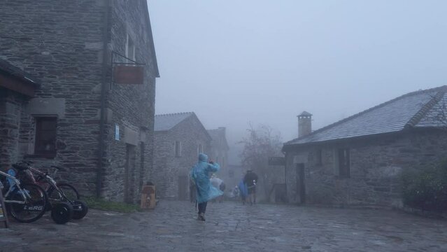 Pilgrims on the way to Santiago in winter beginning the stage in O Cebreiro.