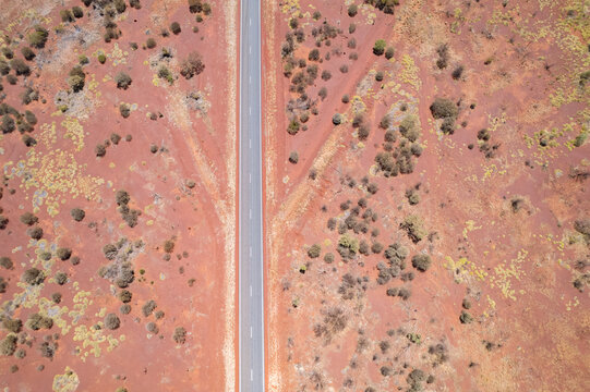 Aerial view of desert road with surrounding shrubbery