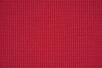 Red wicker plastic abstract texture background.
