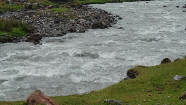The stormy mountain river Terek in the valley of the Truso gorge. Nature of Georgia. Horizontal slow motion 4k footage