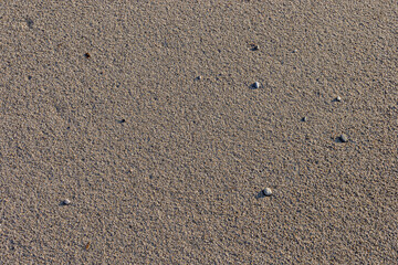 Fototapeta na wymiar The natural texture of the sand on a Sicilian beach