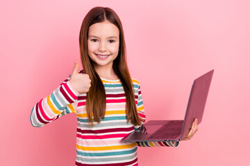 Photo of confirmation sign thumb up little girl enjoy playing video games mobile simulation netbook...