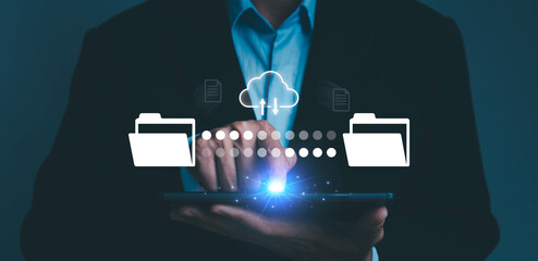 document file transfer. businessman working on a laptop using FTP. data files between folders to...