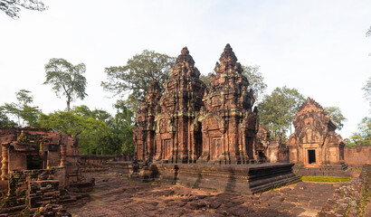 Banteay Srei Hindu temple dedicated to Shiva. The temple built in red sandstone was rediscovered 1814 in the jungle of the Angkor wat complex area of Cambodia. - obrazy, fototapety, plakaty