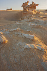 Desert eroded rock pattern with clear sky during the hot sun. Desert rock formation with erosion.