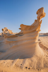 Desert eroded rock pattern with clear sky during the hot sun. Desert rock formation with erosion.