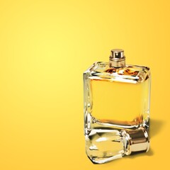 Elegant transparent perfume bottle on desk