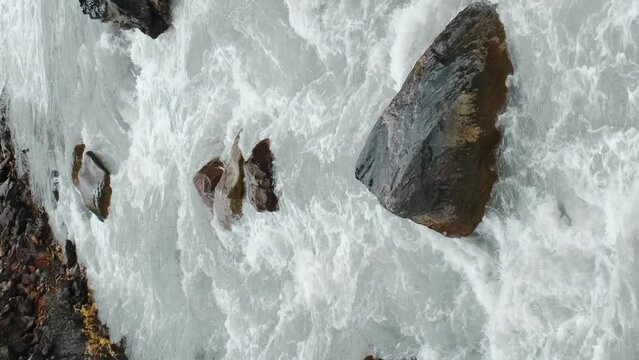 The stormy mountain river Terek in the valley of the Truso gorge. Nature of Georgia. Vertical slow motion 4k footage