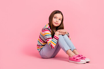 Full length body photo of thinking young girl kid relaxed dreams come true imagine her future high...