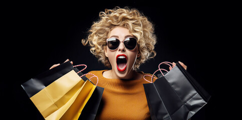 Young woman with sunglasses shopping bags and expression of surprise for Black Friday deals. Promotional marketing offer and online shopping concept