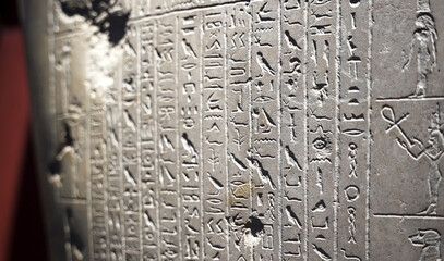 Close up of the egyptian hieroglyphs on a stone slab in The Museum in Cairo. Heritage of ancient civilization in archaeological excavation
