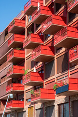 Red apartment building with big balconies seen in Berlin, Germany