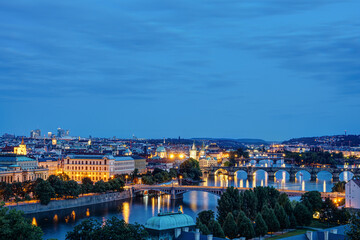 View of Prague with the bridges over the river Vltava at twilight