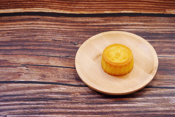 Mooncakes on wooden table. Mid-Autumn Festival background. Copy space.