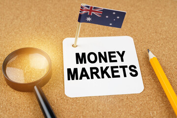 On the table is the flag of Australia and a sheet of paper with the inscription - money markets