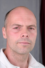 Portrait of a young man with a short haircut