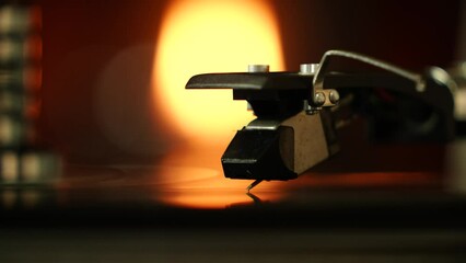 Needle of Vinyl long Play turntable on during reading music high resolution sound quality retro Smoot turn and touch for background.