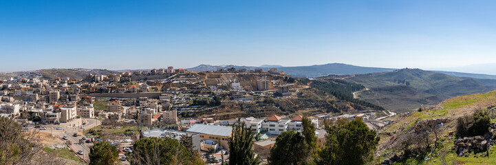 Fototapeta na wymiar Panoramic view of the Arab village of Majdal Shams at the base of Mount Hermon in the Golan Heights in northern Israel. 