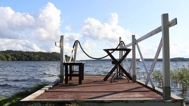 Landscape view at a lake.  Outside furniture at a bridge. Stockholm, Sweden, Scandinavia, Europe.