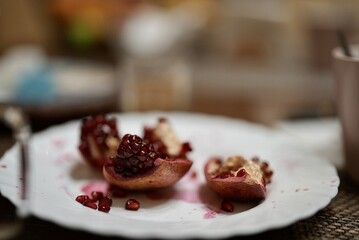 Juicy pomegranates on a ceramic plate