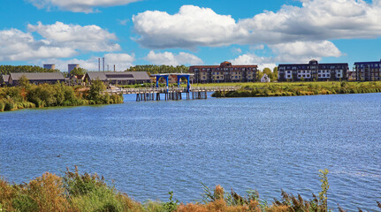Thorn (Maasresidence), Netherlands - September 24. 2023: Beautiful lake at river Maas with new luxury vacation resort