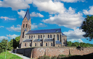 Fototapeta na wymiar Ancient dutch church in rural village in summer - Linne (St. Martinus Kerk), Limburg, Netherlands