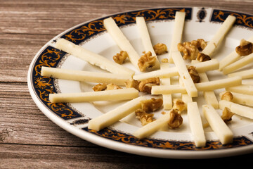 Cheese and Nuts Delight: A harmonious pairing of cheese and assorted nuts, a fusion of creamy and...