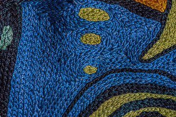 Abstract background closeup of embroidery with art stitches. Rough Coarse thread, thick seams....