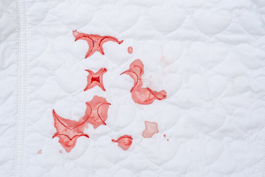 Dirty blood stains on a white cloth. bloodstained clothing. daily life stain concept. High quality photo