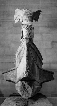 The Winged Victory of Samothrace, or the Nike of Samothrace. Exhibited at the Louvre Museum in Paris, at the top of the main staircase, since 1884. Black and white photography.